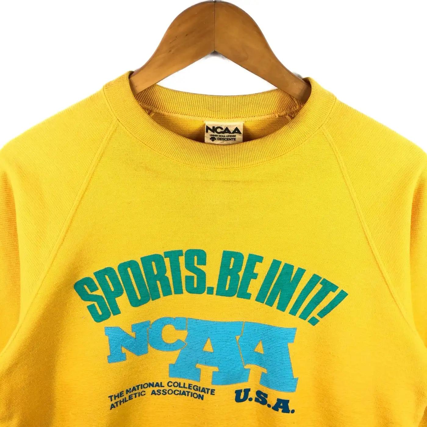 NCAA Descente Sweatshirt Big Logo T-Shirt Sweatshirt Pullover Hoodie Reprinted Full Color Full Size Gift For NCAA Fans - Image 2