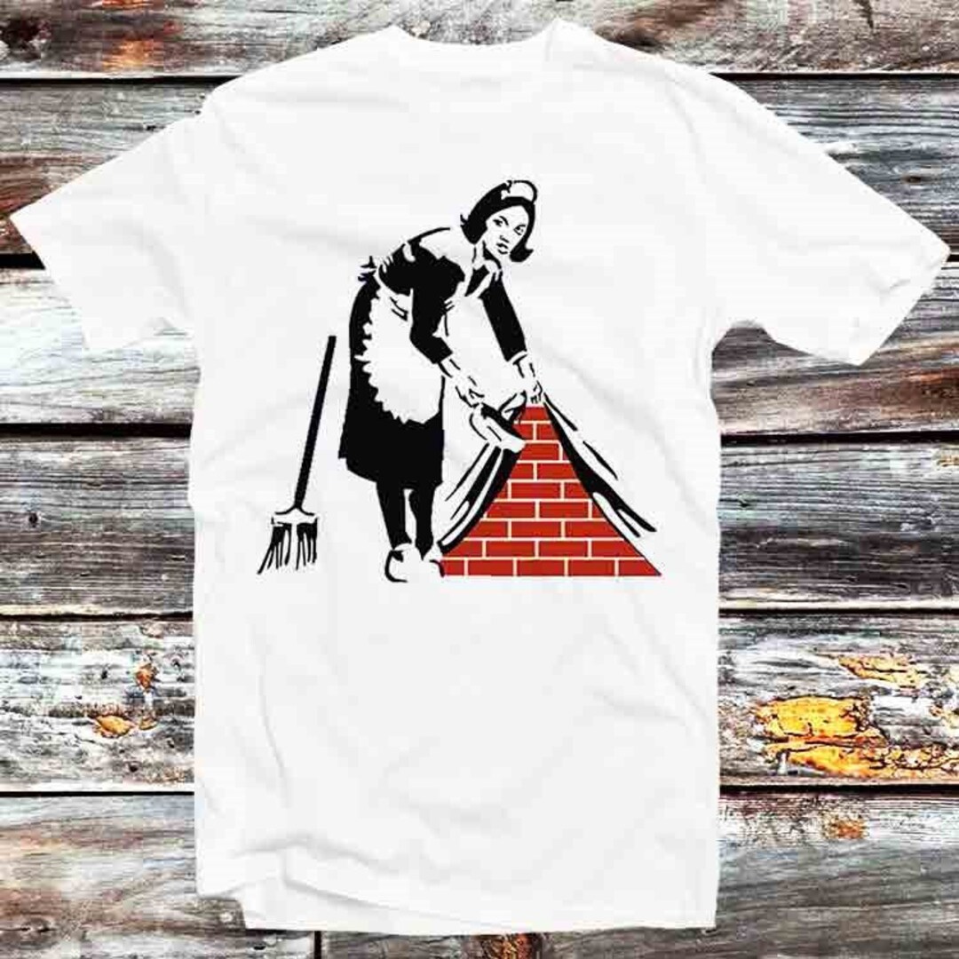 Banksy's Under the Rug Message Unisex Anime T-Shirt - Art Lover Gift with a Message