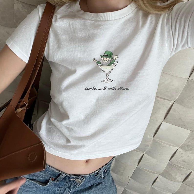 St. Patrick's Day Baby Tee for Women - Leprechaun Martini Cocktail Shirt with a Fun Twist