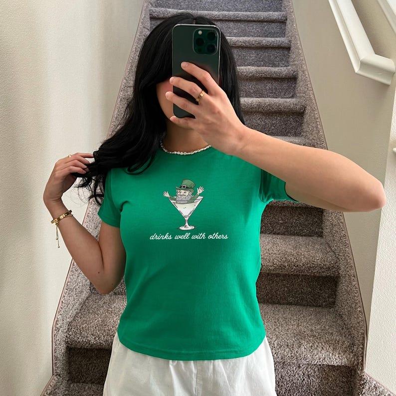 St. Patrick's Day Baby Tee for Women - Leprechaun Martini Cocktail Shirt with a Fun Twist